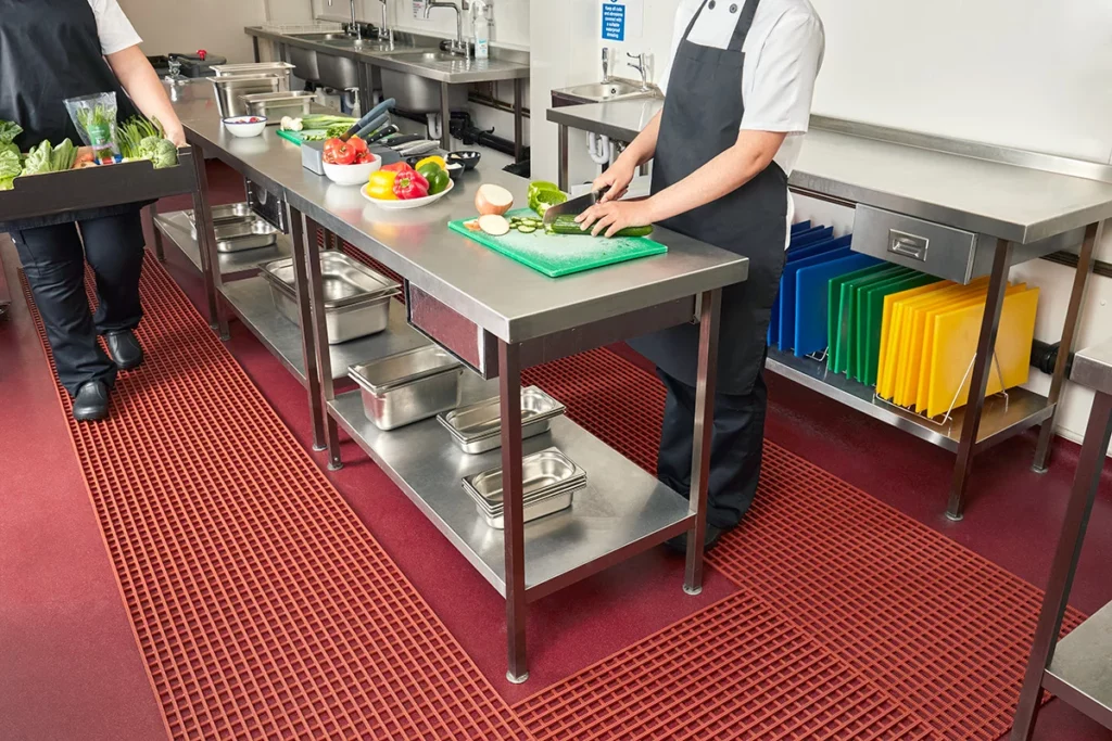 PVC shelving and worktables in a professional kitchen.